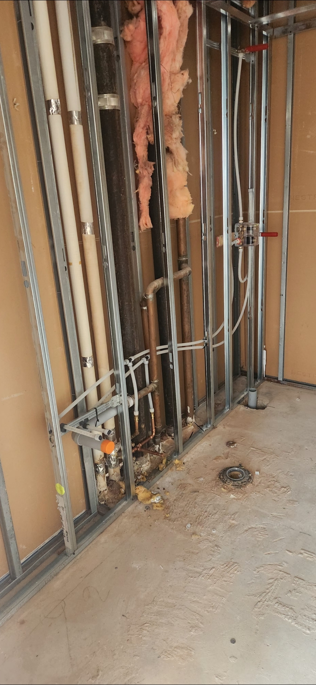 Pipe rough-in and drain installation in commercial build